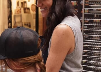 Lilibet's braided red hair was shown in rare photos from the family's volunteering day in Los Angeles