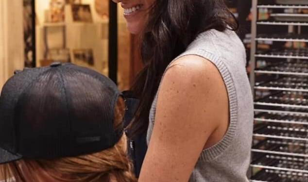 Lilibet's braided red hair was shown in rare photos from the family's volunteering day in Los Angeles