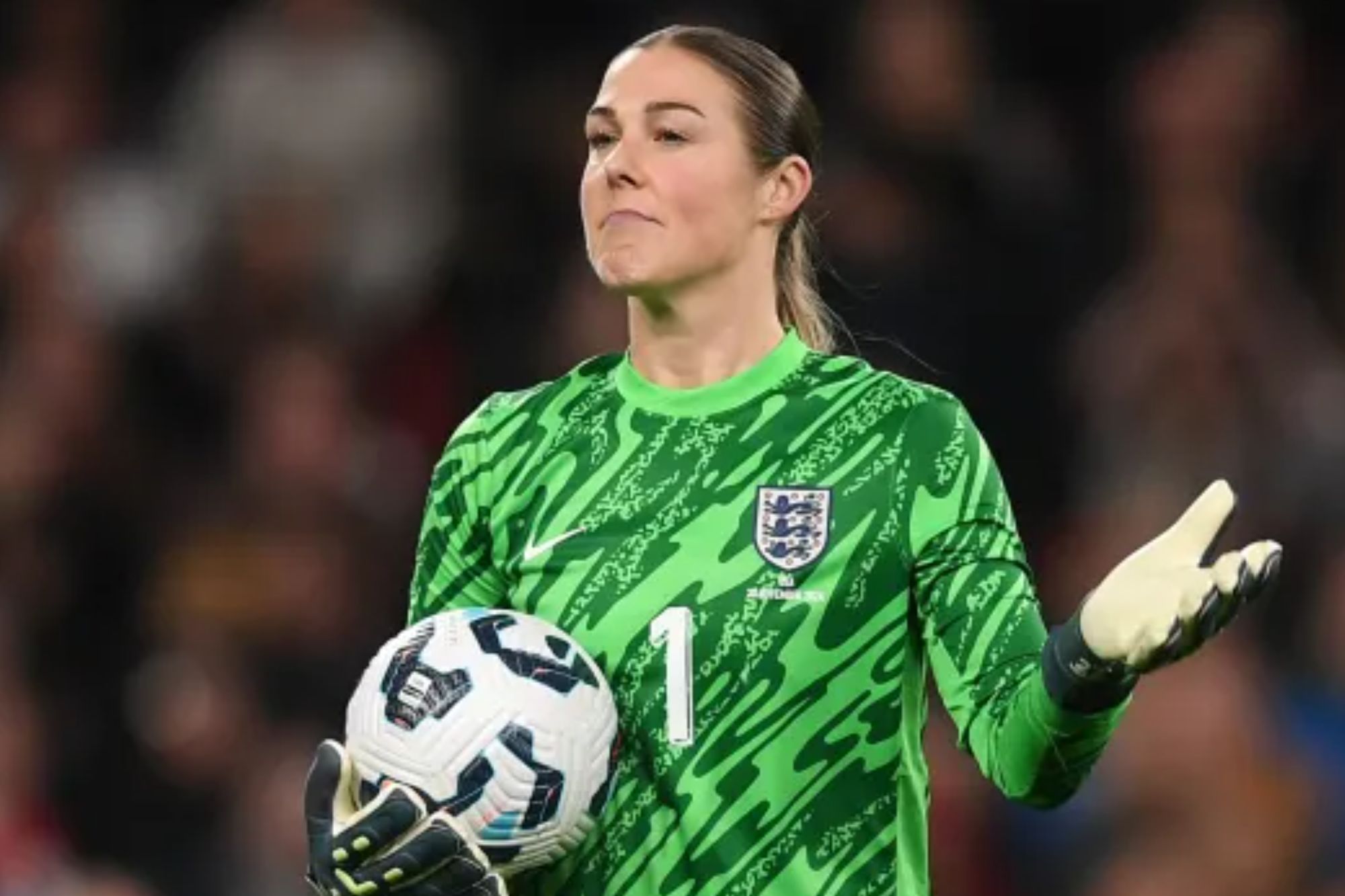An image collage containing 1 images, Image 1 shows England goalkeeper Mary Earps in a green uniform and gloves, holding a soccer ball at Wembley Stadium