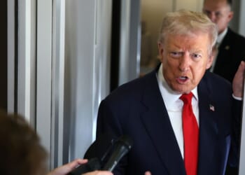 President Donald Trump speaks to members of the media on board Air Force One on Oct. 31, 2025, at Joint Base Andrews, Maryland.