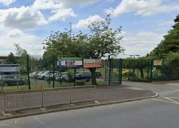 The school in Bolton alerted the police, and officers rushed to The Orchards Federation in Farnworth just after 11am on Tuesday morning. Greater Manchester Police confirmed that a woman in her 20s was arrested on suspicion of voyeurism offences and has since been bailed