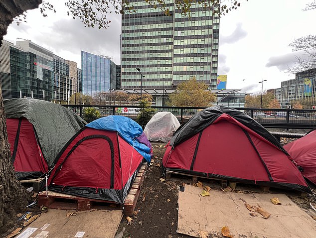 The collection of tents has sprung up in one of the city's busiest shopping hubs