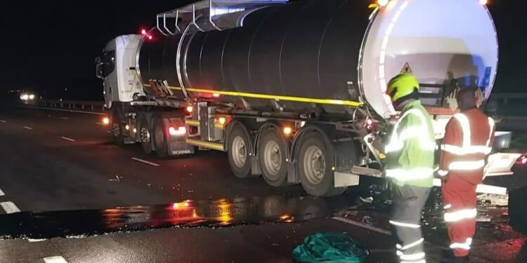 M40 closed after serious crash involving car and tanker with spillage clean up causing severe delays