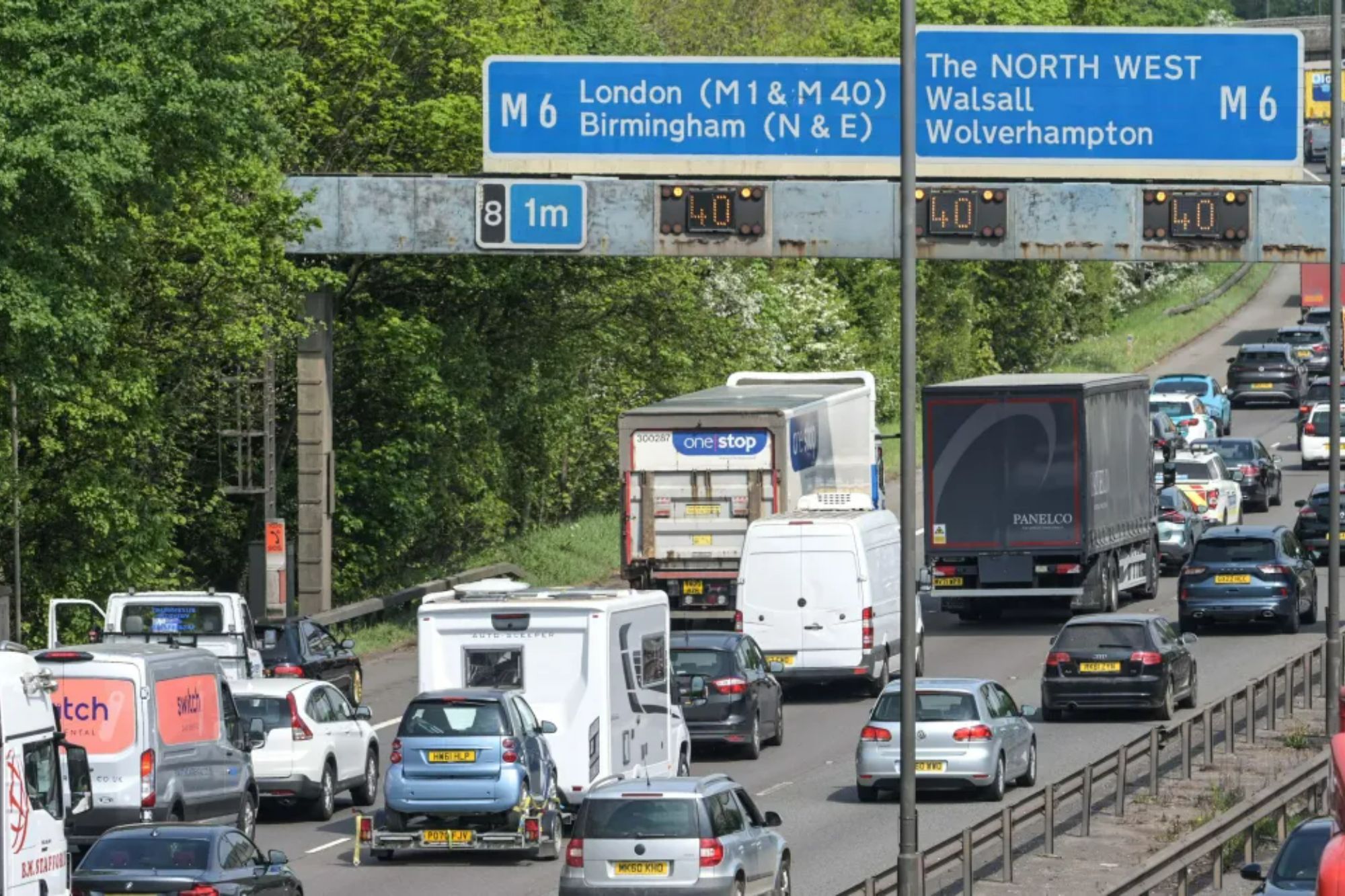 An image collage containing 1 images, Image 1 shows Bank holiday traffic on a motorway with signage for London and The North West, displaying 40 mph speed limits