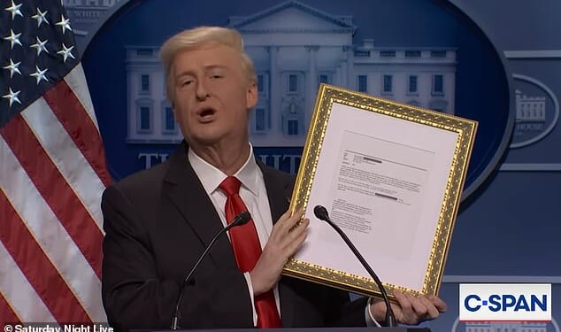 Donald Trump, played by James Austin Johnson, held up a framed Jeffrey Epstein email mentioning him