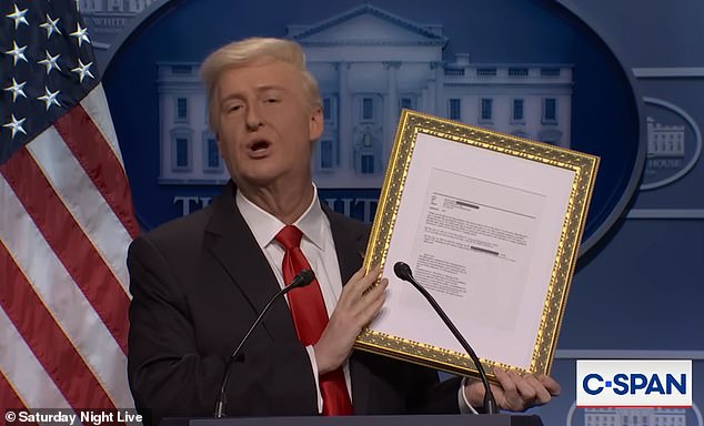 Donald Trump, played by James Austin Johnson, held up a framed Jeffrey Epstein email mentioning him