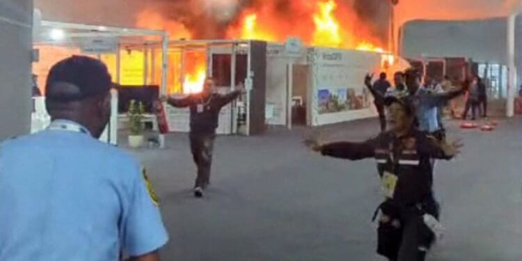 A screen grab taken from AFPTV video footage shows emergency crews battling a fire that broke out Thursday at a pavilion inside the venue of the COP30 UN Climate Change Conference in Belem, Para state, Brazil.