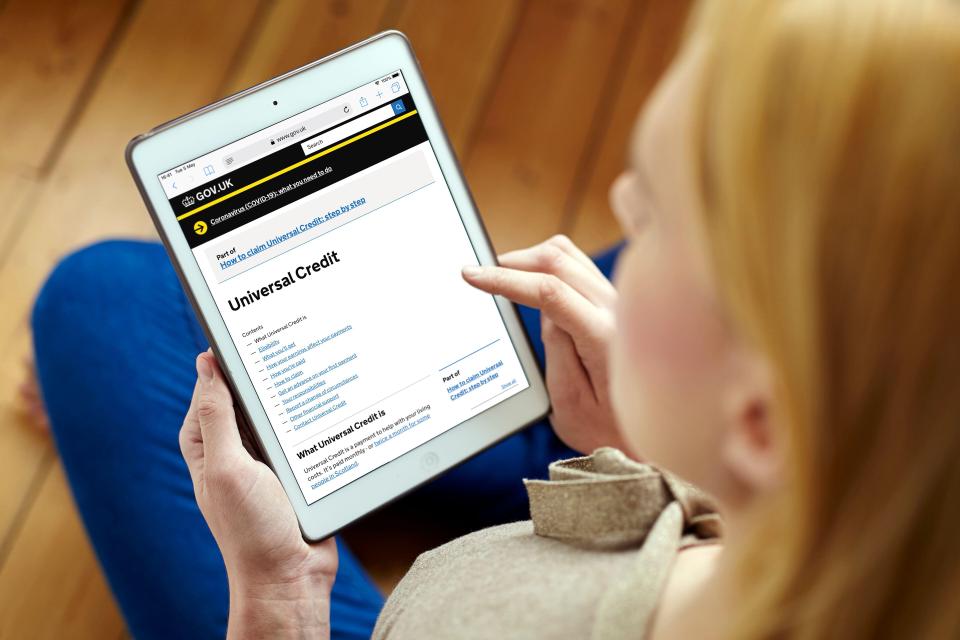 Woman applying for Universal Credit on a tablet.