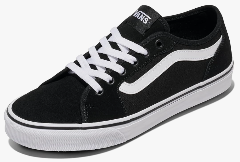 Black Vans shoe with white laces and white stripe on the side.
