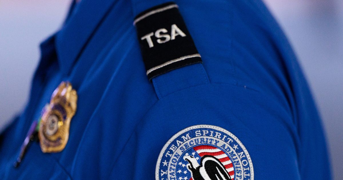 An employee of the Transportation Security Administration stands at Orlando International Airport in Orlando, Florida, on Nov. 9, 2025.
