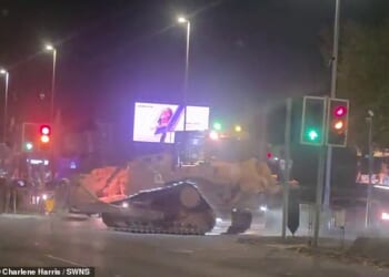 A 'stolen' bulldozer is driven through Wolverhampton city centre on the evening of November 8