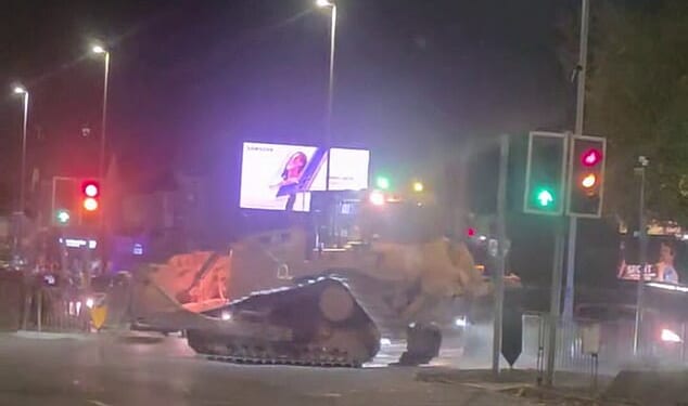 A 'stolen' bulldozer is driven through Wolverhampton city centre on the evening of November 8
