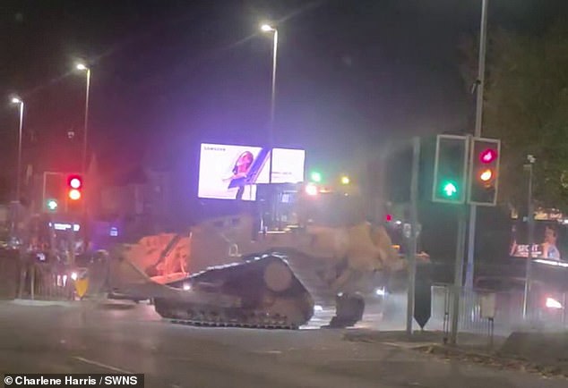A 'stolen' bulldozer is driven through Wolverhampton city centre on the evening of November 8