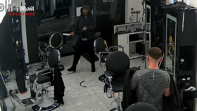 CCTV footage exclusively obtained by the Daily Mail allegedly shows a knifeman entering Ritzy Barbers in Peterborough, Cambridgeshire on Friday - one day before the attack