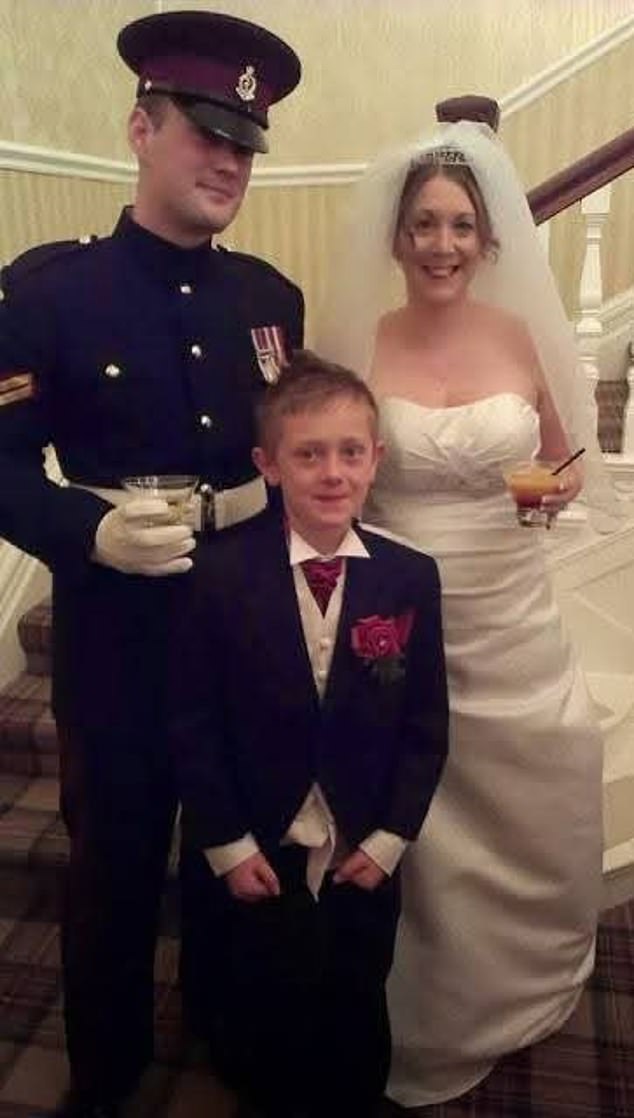 Robert Purkiss, wearing the formal attire of the Lancashire Regiment, and Kelly Purkiss on their wedding day. She insisted her husband is innocent and will be vindicated