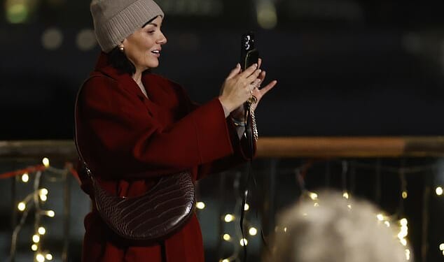 Ms McCutcheon, 49, who played Natalie, the Downing Street tea lady who stole prime minister Hugh Grant ’s heart, was seen wearing the same red coat that became one of the most memorable outfits from the film