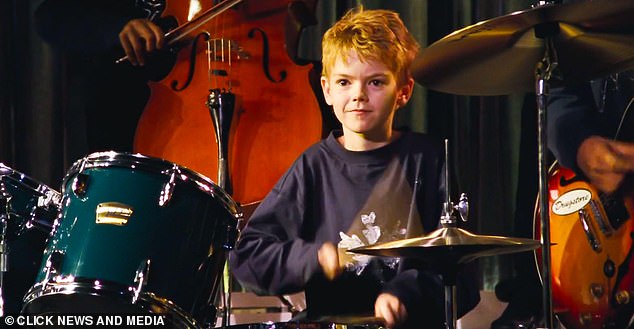 Brodie-Sangster pictured here playing the drums as a young boy in the Nativity scene of Love Actually