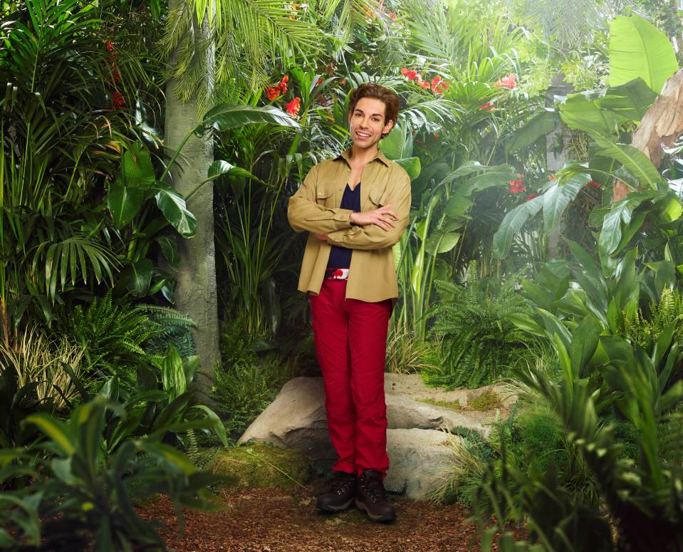 Tom Read Wilson smiling in a jungle setting.
