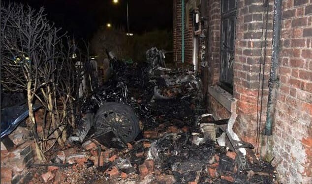 Zachary Hocking, 28, was driving a McLaren 570GT V8 at an average speed of 91mph in a 30mph zone when he lost control and ploughed into the property in the seaside town of Lytham St Annes, Lancashire. Pictured: The blackened remains of supercar lie amid piles of bricks dislodged in the crash