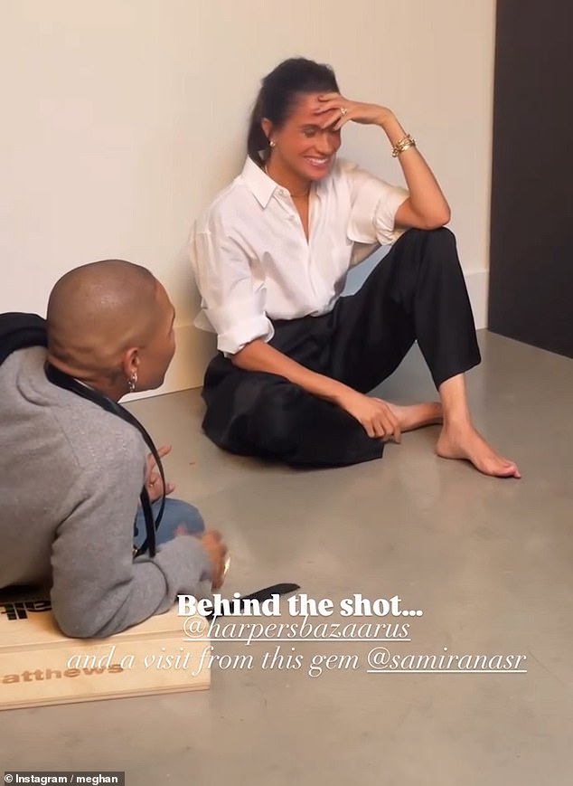 In the behind the scenes footage Meghan, 44, blushes and covers her face with her hand before a male staff member tells her she was '10 out of 10'