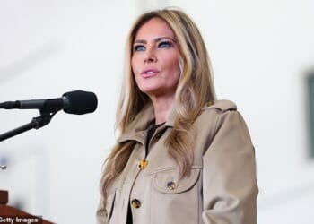 First lady Melania Trump delivers remarks to military personnel and their families during a visit to MV-22 Mega Hangar on Marine Corps Air Station New River on November 19, 2025 in Jacksonville, North Carolina