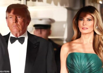 President Donald Trump (left) and First Lady Melania Trump (right) wait for the arrival of Saudi Crown Prince Mohammed bin Salman for a dinner in the East Room Tuesday night at the White House