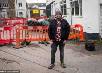 A neighbour told owner, Malcolm McKenzie about his car - where he found it trapped in a hole with the bonnet raised a foot in the air