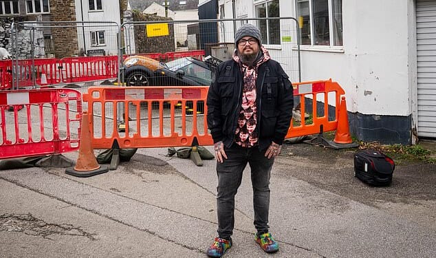 A neighbour told owner, Malcolm McKenzie about his car - where he found it trapped in a hole with the bonnet raised a foot in the air