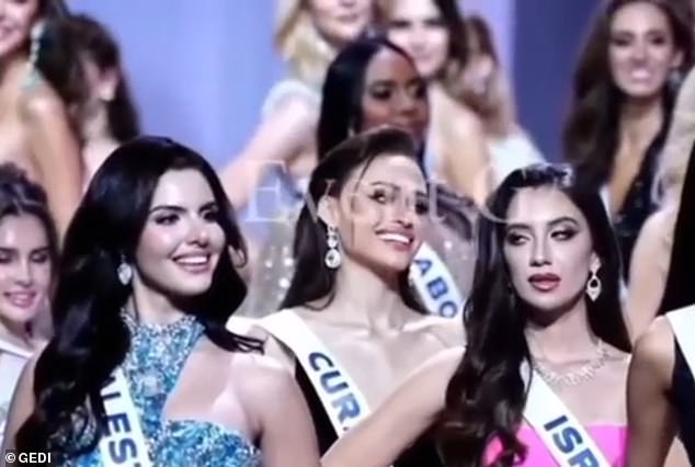 Ms Shiraz appeared to turn her head towards Miss Palestine, Nadeen Ayoub, pictured left