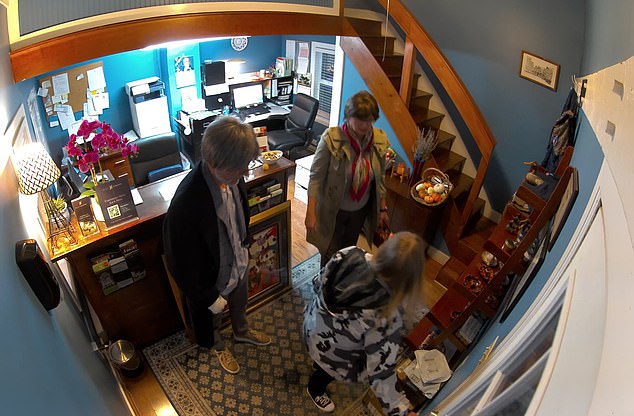 This is the moment a British holidaymaker and accomplice 'steal £30,000 of fine wine' in audacious US distraction theft as she could face up to 50 years in jail