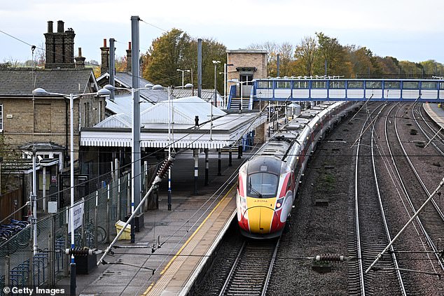 Witnesses who were onboard when the Huntingdon train 'terror' attack unfolded have recalled the terrifying moment a victim came running down the carriage screaming 'someone's got a knife' (Pictured: The train still parked on the platform this morning)