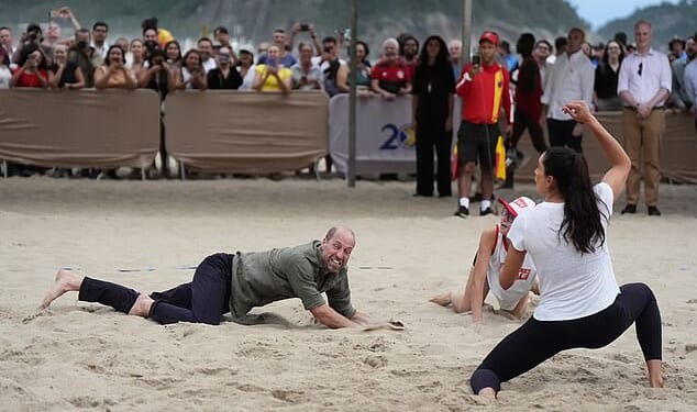 The Prince of Wales takes part in a game of volleyball with players from thee Levante Institute, a local beach volleyball school, at Copacabana Beach in Rio de Janeiro