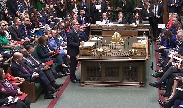 Ms Reeves can be seen looking at Torsten Bell's phone while Sir Keir Starmer is speaking