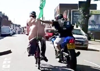 A council binman was caught on camera punching a naked cyclist on a charity bike ride off his bike in Colchester, Essex, after mistaking him for a 'pervert'