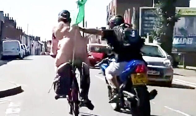 A council binman was caught on camera punching a naked cyclist on a charity bike ride off his bike in Colchester, Essex, after mistaking him for a 'pervert'