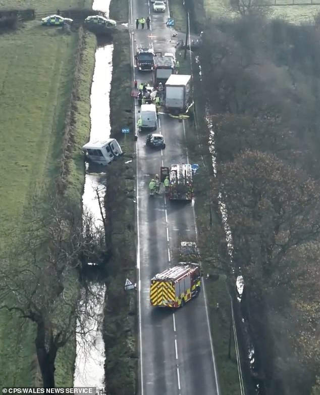 An aerial view of the aftermath of the crash, which left a mini-van lying in a ditch and multiple vehicles damaged