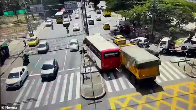 Footage captured the massive dumper truck flying downhill at a frightening speed, its brakes seemingly gone, as panicked motorists sat trapped in a queue of traffic in the Medellín district of Robledo, Colombia, on November 22