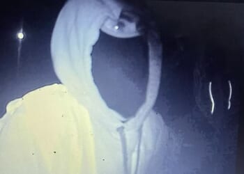 Hooded men were filmed with their 'power tools' on a hidden camera as they removed the banners at the De Luci Fish roundabout in Erith, London