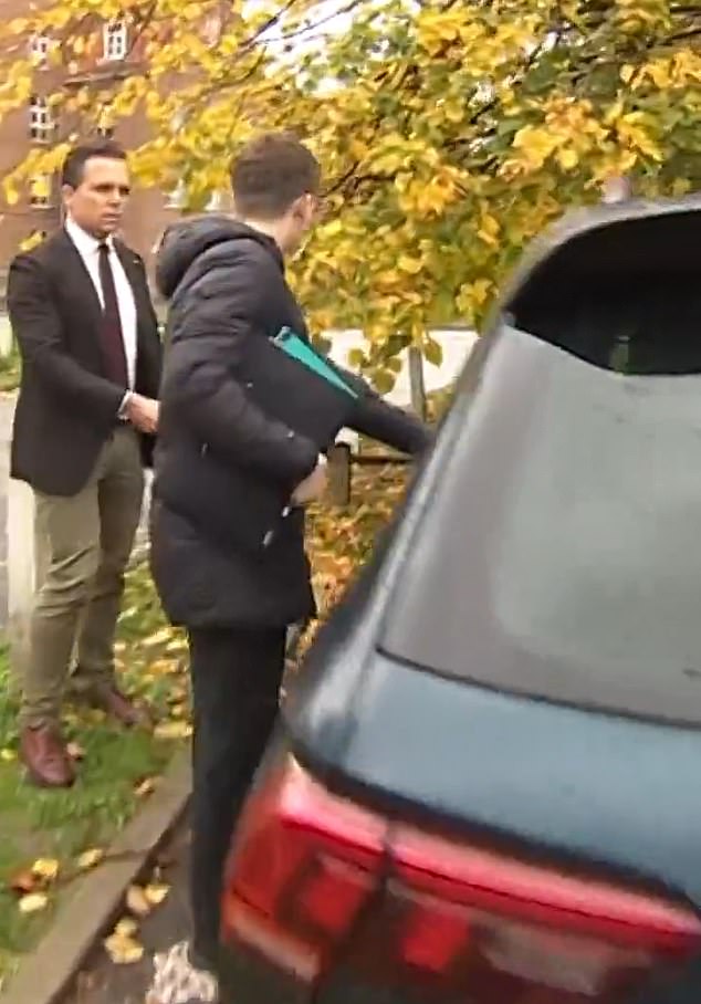 He was asked if he had anything to say to the parents whose children he abused, but again gave a 'no comment' response before getting in a car with his mother