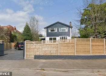 A mother has been ordered to tear down her £4,000 fence, pictured, despite not a single neighbour complaining