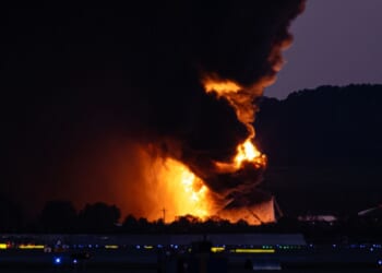 A fireball erupts near airport property after a plane crash at Louisville International Airport Tuesday in Louisville, Kentucky.
