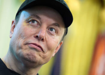 Elon Musk listens as President Donald Trump speaks during a news conference in the Oval Office of the White House on May 30, 2025, in Washington, D.C.