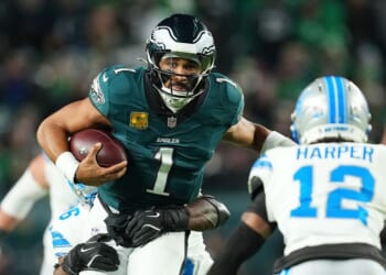 Jalen Hurts of the Philadelphia Eagles is brought down by Al-Quadin Muhammad of the Detroit Lions during the first half at Lincoln Financial Field on Nov. 16, 2025, in Philadelphia, Pennsylvania.