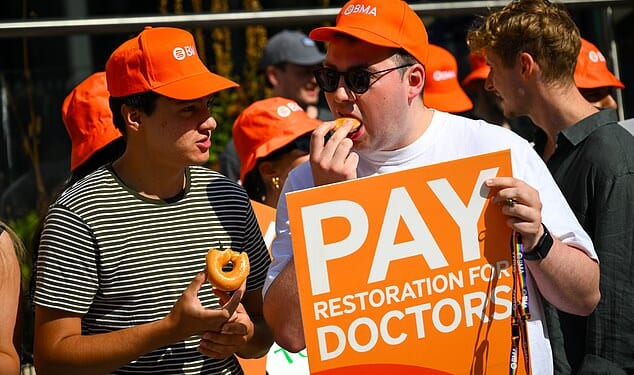 Striking doctors guzzle donuts on a BMA picket line