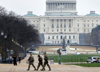 National Guard troops patrol on the National Mall near the US Capitol on Nov. 26, 2025 in Washington, DC.