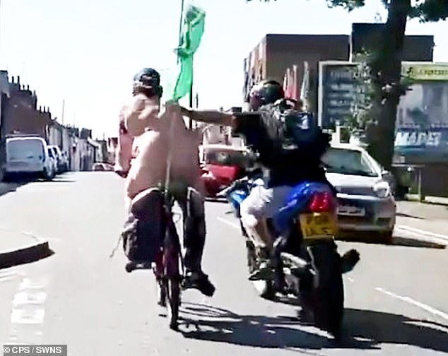 Binman Lee Turnage (right) was caught on camera punching Mr Brown during the naked charity ride