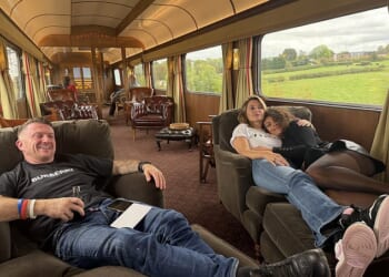 A picture posted online by Mr Fox, the leader of the Reclaim Party, showed Ms Valance, Mrs Fox and Mr Robinson sprawled on a sofa in one of the train's carriages