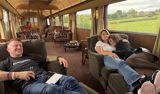A picture posted online by Mr Fox, the leader of the Reclaim Party, showed Ms Valance, Mrs Fox and Mr Robinson sprawled on a sofa in one of the train's carriages