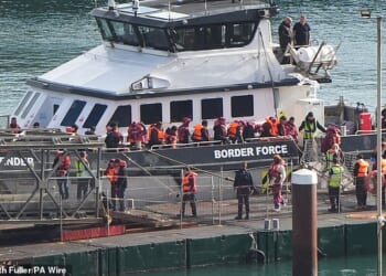 Migrants arrive at the Port of Dover yesterday - the same day a previously-deported migrant came back to Britain