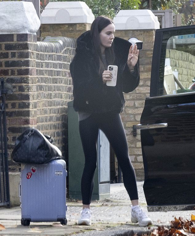 She was ready for action with various items of luggage in tow